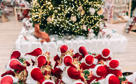 Several small toy Santa Clauses stand in a groupの写真素材