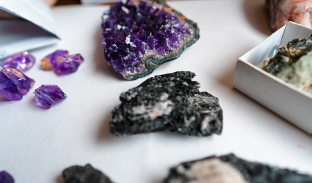 Collection of beautiful precious stones on white table.の写真素材