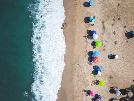 Beach with sun loungers on the coast of the oceanの写真素材