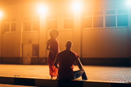 A young sexy couple lovers pose on the night street of the city.の写真素材
