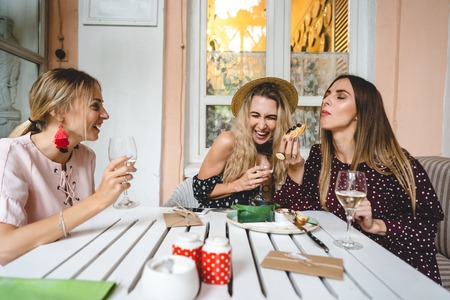 Three girls at the tableの写真素材
