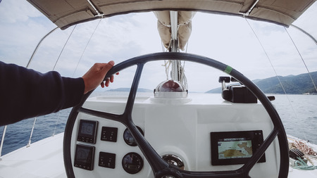 Ship control panel with steering wheel on the captain bridge