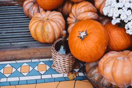 Autumn decoration with pumpkins and flowers on a street in a European cityの写真素材