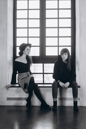 Two beautiful girls posing for the cameraの写真素材