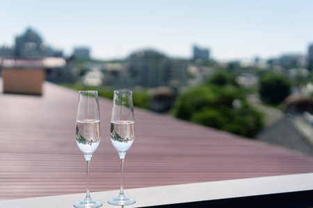 Two glasses of champagne on the roofの写真素材