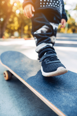 Boy legs on the skateboard close up imageの写真素材