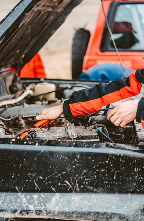 Jump-Starting the Dead Battery using jumper electrical wires.