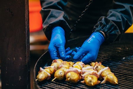 Potato with bacon on skewers cooked at the stakeの写真素材