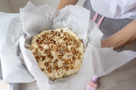 Image of walnut on cottage cheese dessert, close view