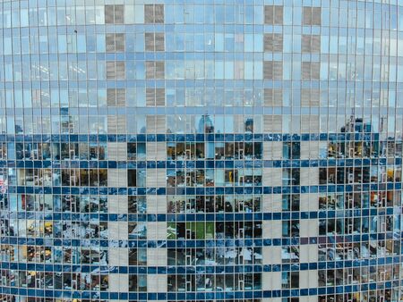 Street reflection on glass steel building facade