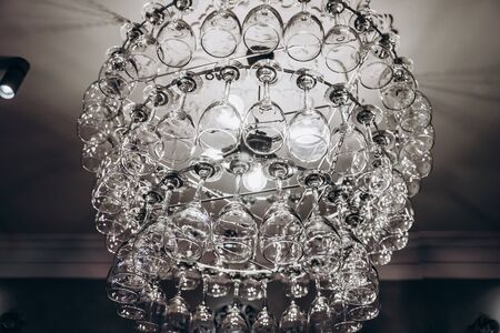 Beautiful chandelier made with glasses of wineの写真素材