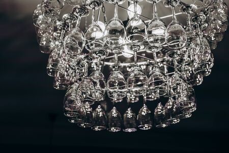 Beautiful chandelier made with glasses of wineの写真素材