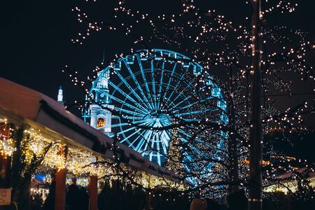 Christmas zone on Kontraktova Square with a Ferris wheel in Kievの写真素材