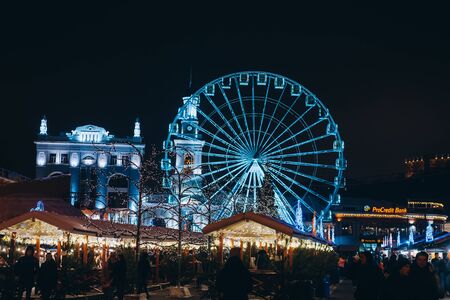 Christmas zone on Kontraktova Square with a Ferris wheel in Kievの写真素材