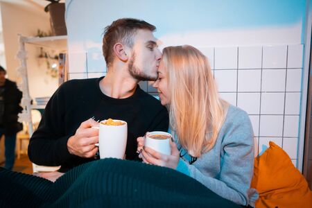 guy with a girl drink hot coffee and teaの写真素材