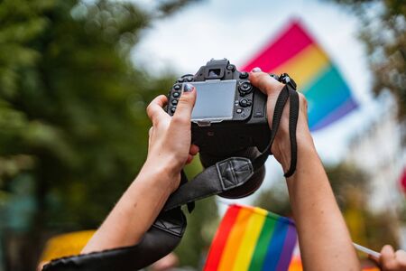 Correspondent takes photo during the Gay Pride paradeの写真素材