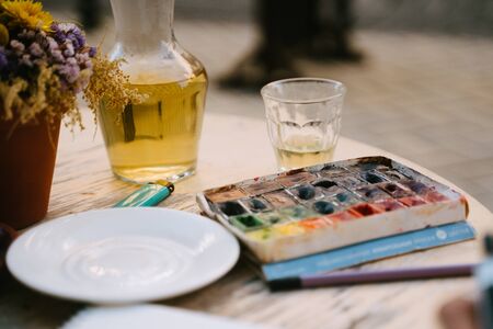 The palette water paints on the table,many color in the palette water paintsの写真素材