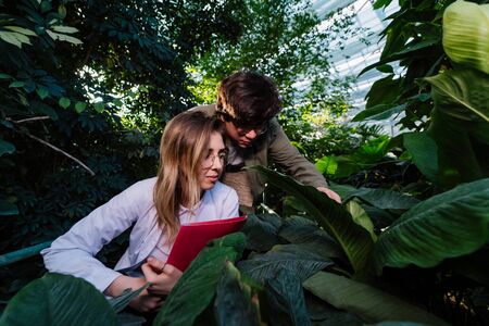 Young agricultural engineers are looking for something in greenhouse