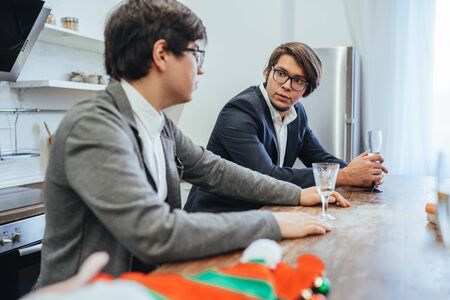 Handsome successful business people talking in office kitchenの写真素材