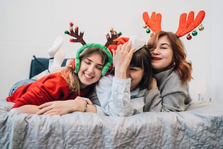 Gorgeous Smiling Female Models Having Fun And Enjoying Pajamas Partyの写真素材