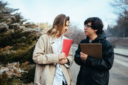 Scientists are studying plant species in the forest.の写真素材