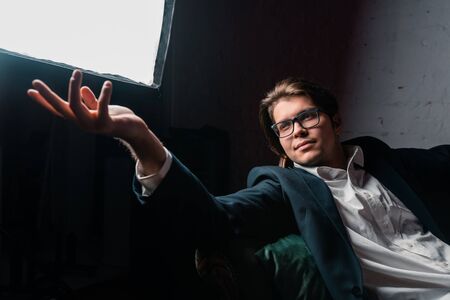 close-up portrait of an attractive young man relaxing on the couch