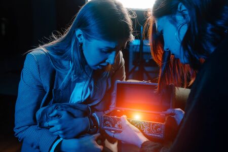 Woman and woman fortune teller with crystal ballの写真素材