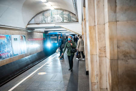UKRAINE, KIEV - MAY 26, 2020: subway station Zoloty Vorota (Golden Gate). People wait at a subway station in Kiev. Subway train arrives at metro stationのeditorial素材