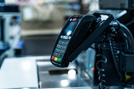 Bank terminal for payment purchases in store by credit cards and paper check receipt
