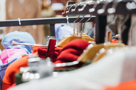 fashion clothing on hangers at the show