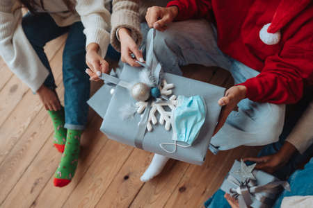 Multiethnic group of friends with gifts in hands, close viewの写真素材