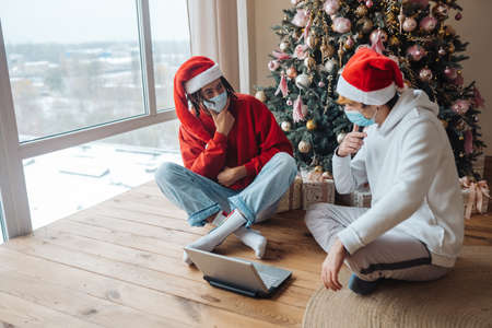 Two friends near the laptop is interacting through video calls.の写真素材