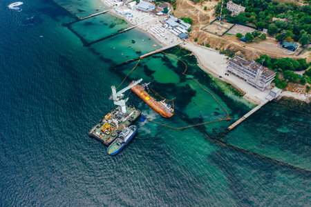 Top view of an old tanker that ran aground and overturned