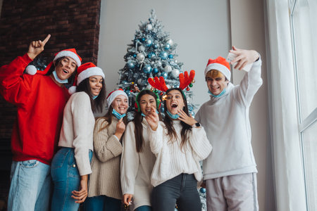 Multi-ethnic young people celebrating New year eve holding sparklersの写真素材