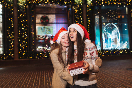 Portrait of happy cute young friends hugging each other