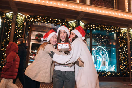 Portrait of happy cute young group of friends hugging each otherの写真素材