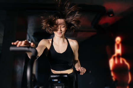 Young woman are engaged in a gym, girls in a gym.の写真素材