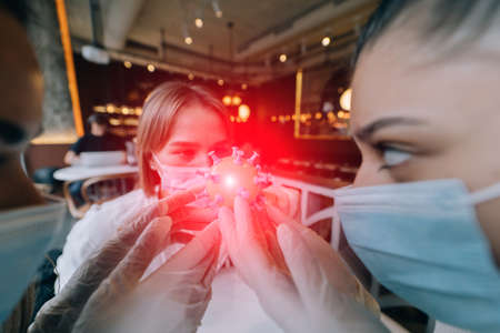 Scientist virologist holding model of new Coronavirus or COVID-19の写真素材