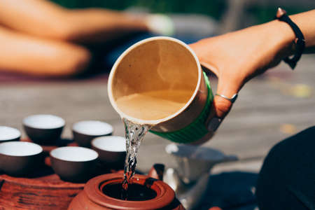 Tea ceremony, Woman pouring traditionally prepared teaの写真素材