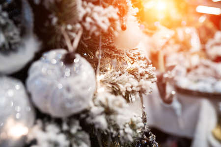 Different object toy gifts hanging on a decorated Christmas tree.の写真素材