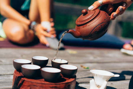 Tea ceremony, Woman pouring traditionally prepared teaの写真素材