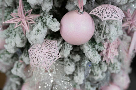 Different object toy gifts hanging on a decorated Christmas tree.の写真素材