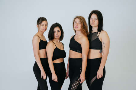 diverse models laughing, enjoying time together, look at cameraの写真素材