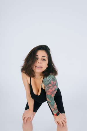 An ordinary young woman on a white background. Bodypositive concept.の写真素材