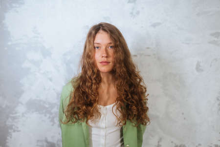 Pretty female looking at camera. Studio shot of beautiful woman.