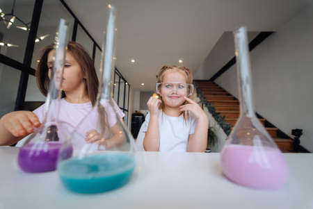 Little girls making chemical experiments at homeの写真素材