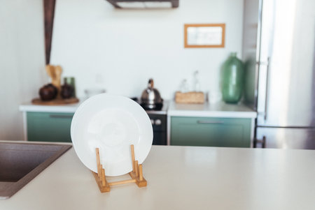 Table board and defocused modern kitchen background.