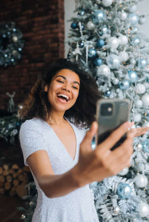 Woman Making Video Message or Selfie Concept of Holidays.の写真素材