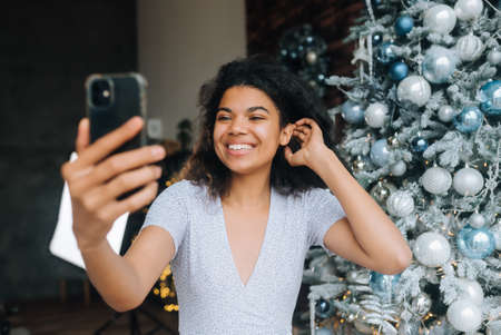 Woman Making Video Message or Selfie Concept of Holidays.