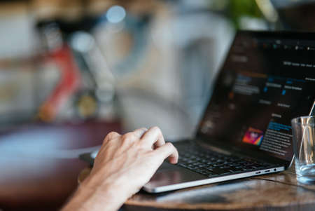 Woman working at home office hand on keyboard
